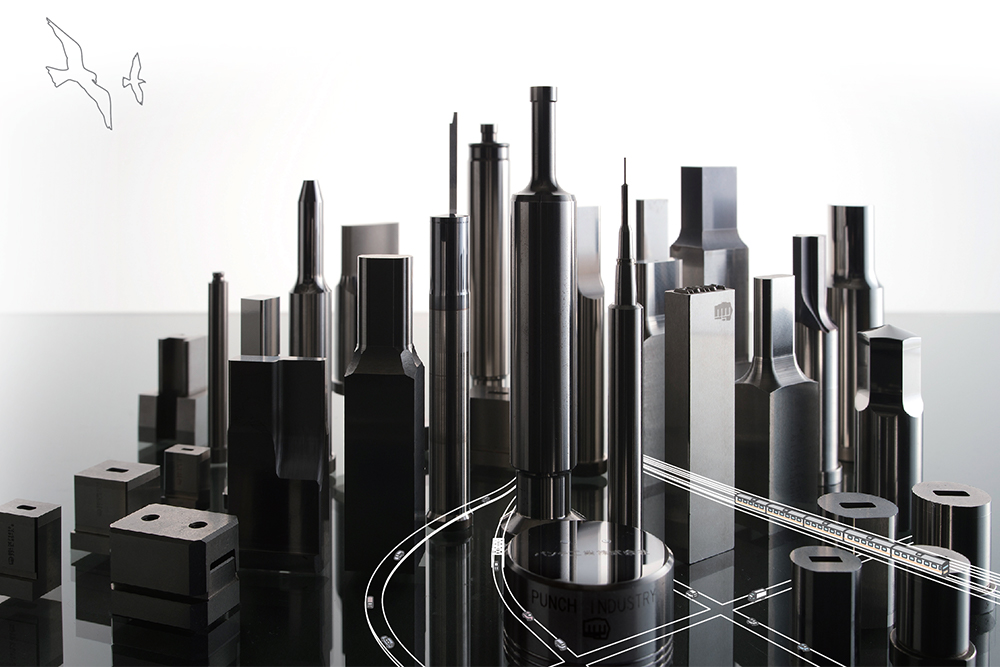 PUNCH mold & die components positioned to form a city skyline